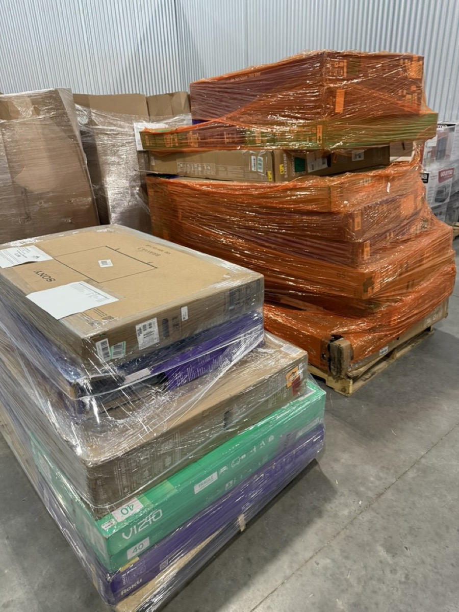 Pallets of boxed TVs and electronics
